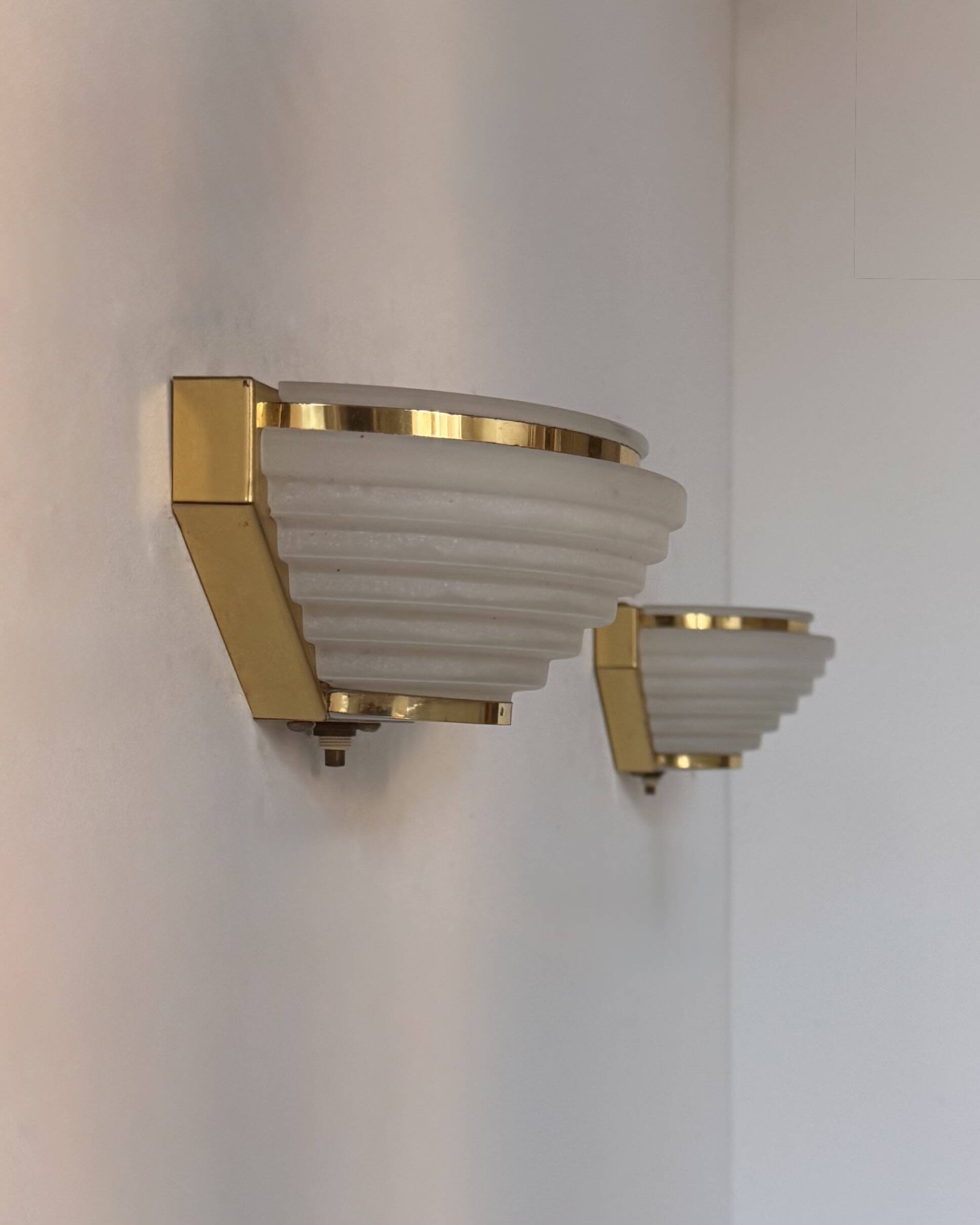 Pair of vintage brass and frosted glass wall lights, France, 1970.