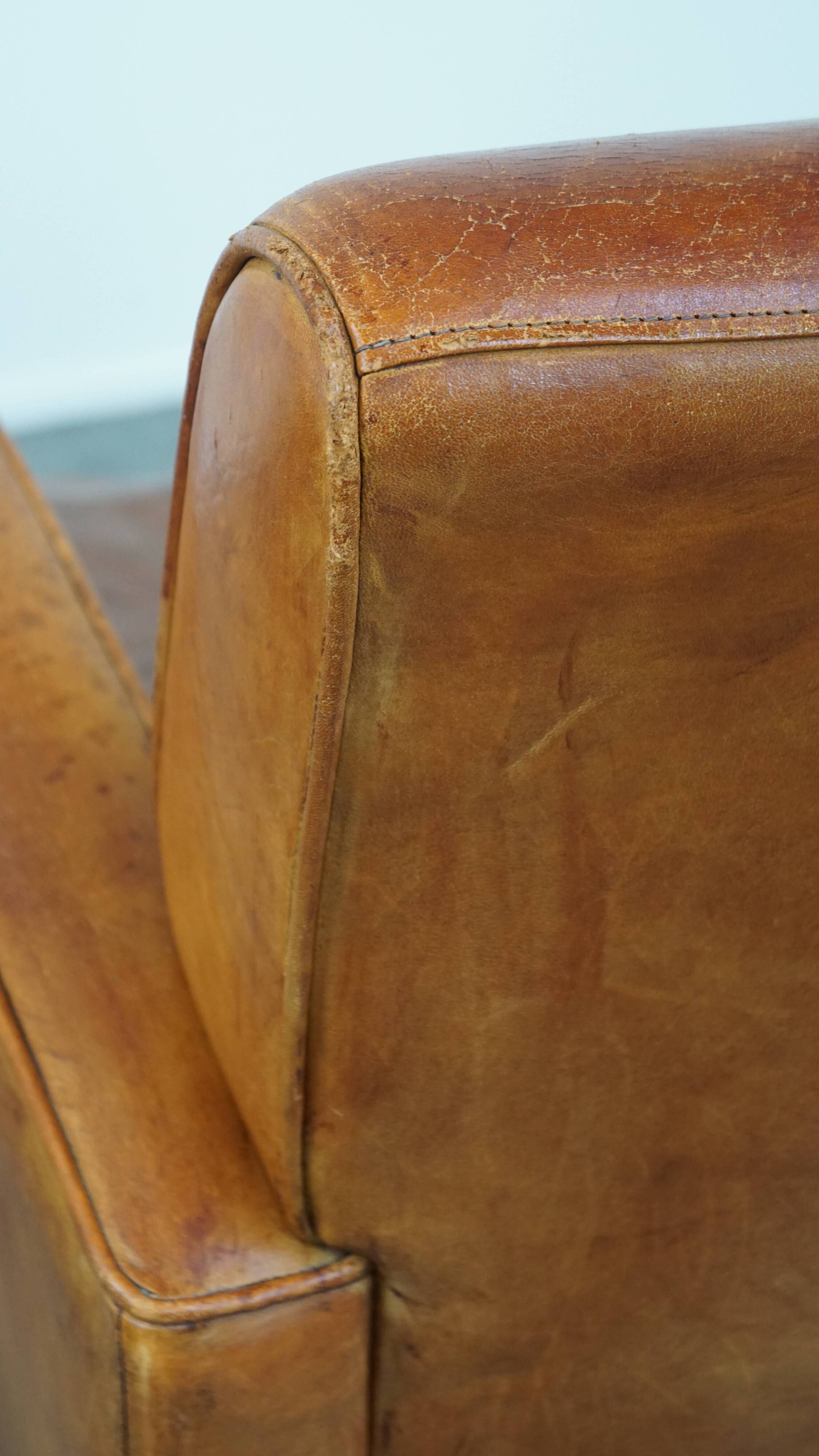 Characteristic sheepskin design armchair in beautiful warm cognac colours