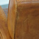 Characteristic sheepskin design armchair in beautiful warm cognac colours