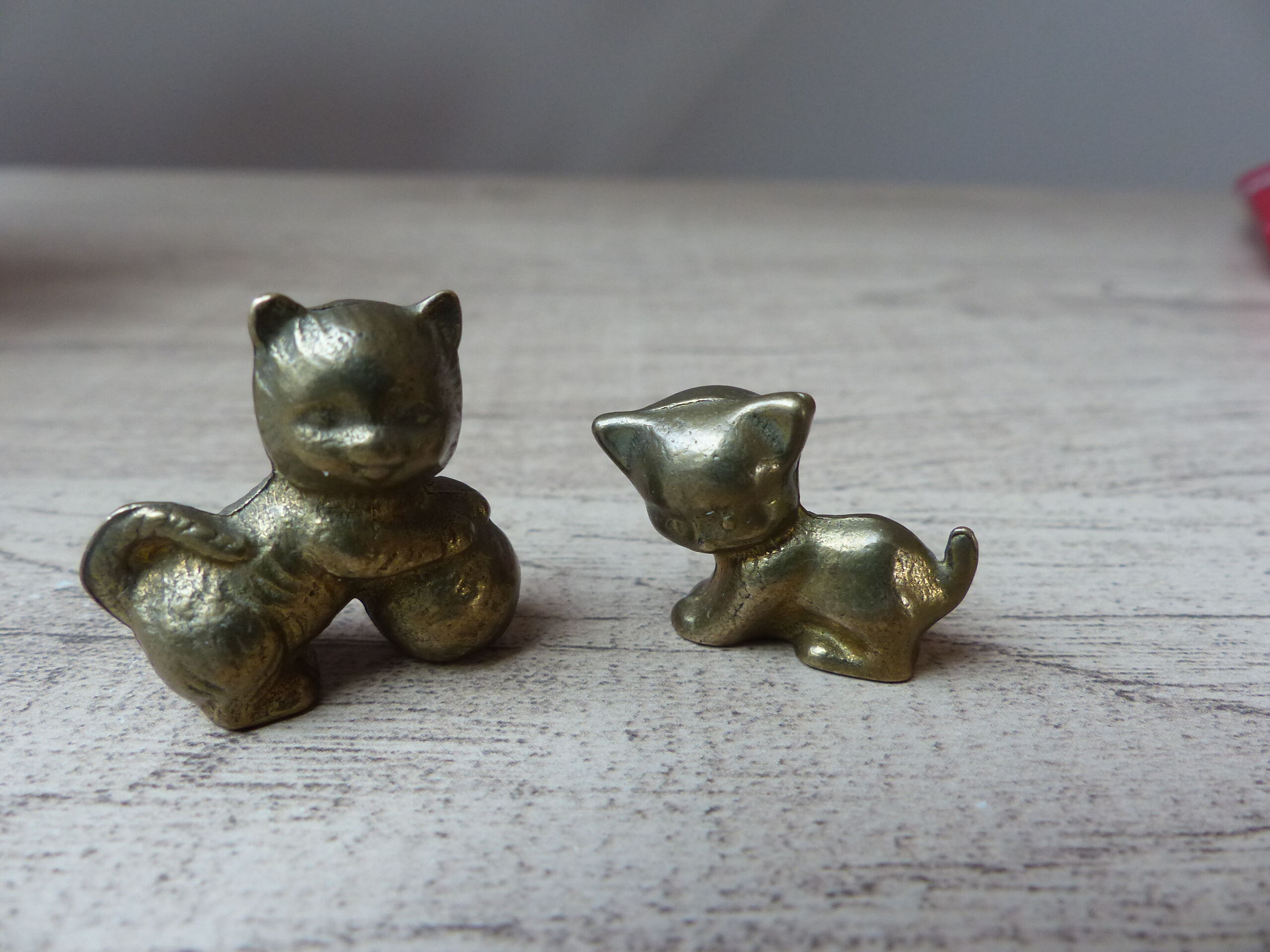 Duo of brass cats