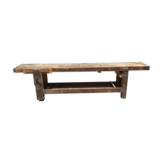 Old carpenter's workbench with press