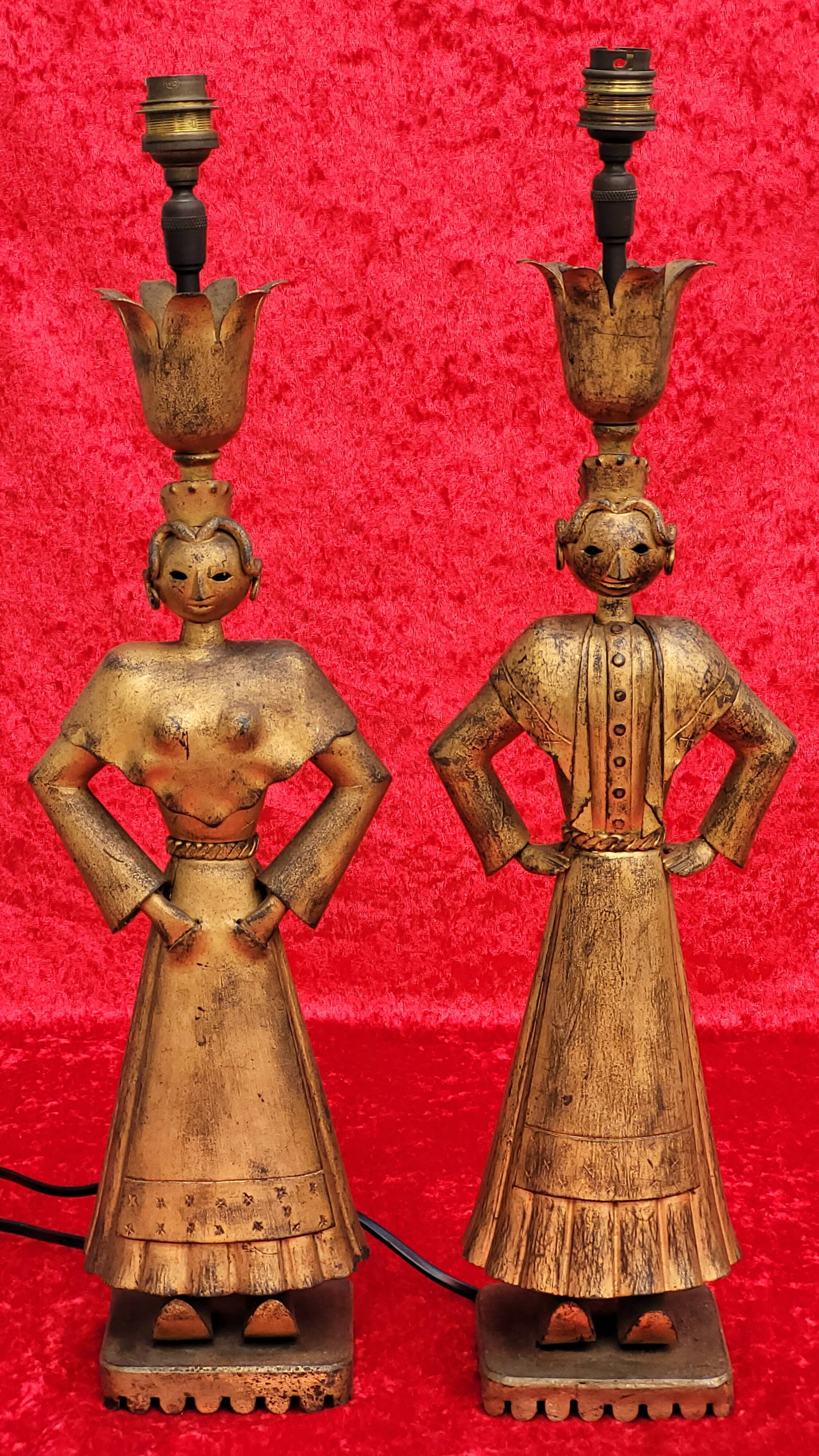 Pair of gilded beaten iron sculpture lamps attributed to Gilbert Poillerat
