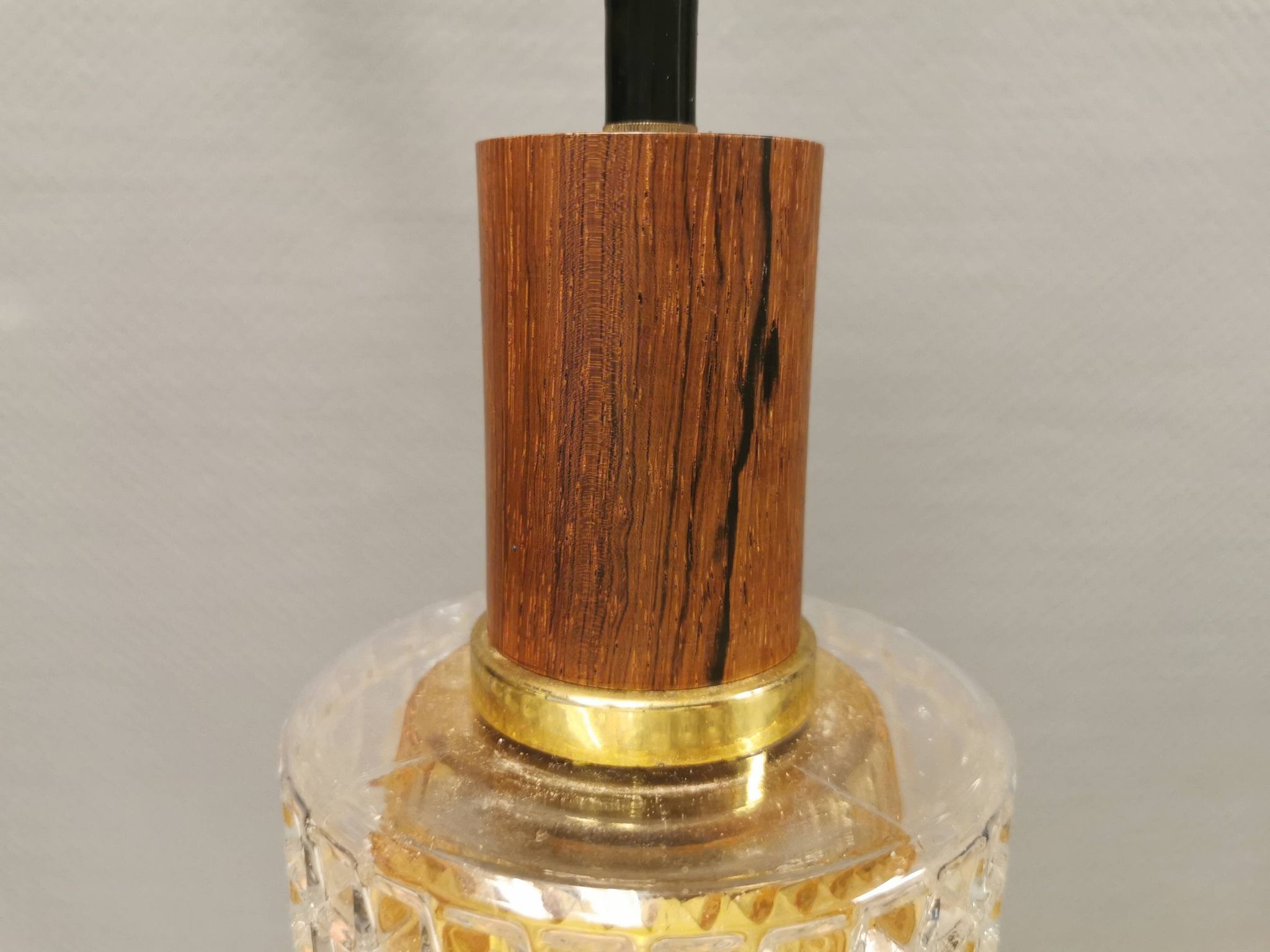 Older Swedish hanging lamp in multi-layered crystal glass with rosewood top and brass ring.