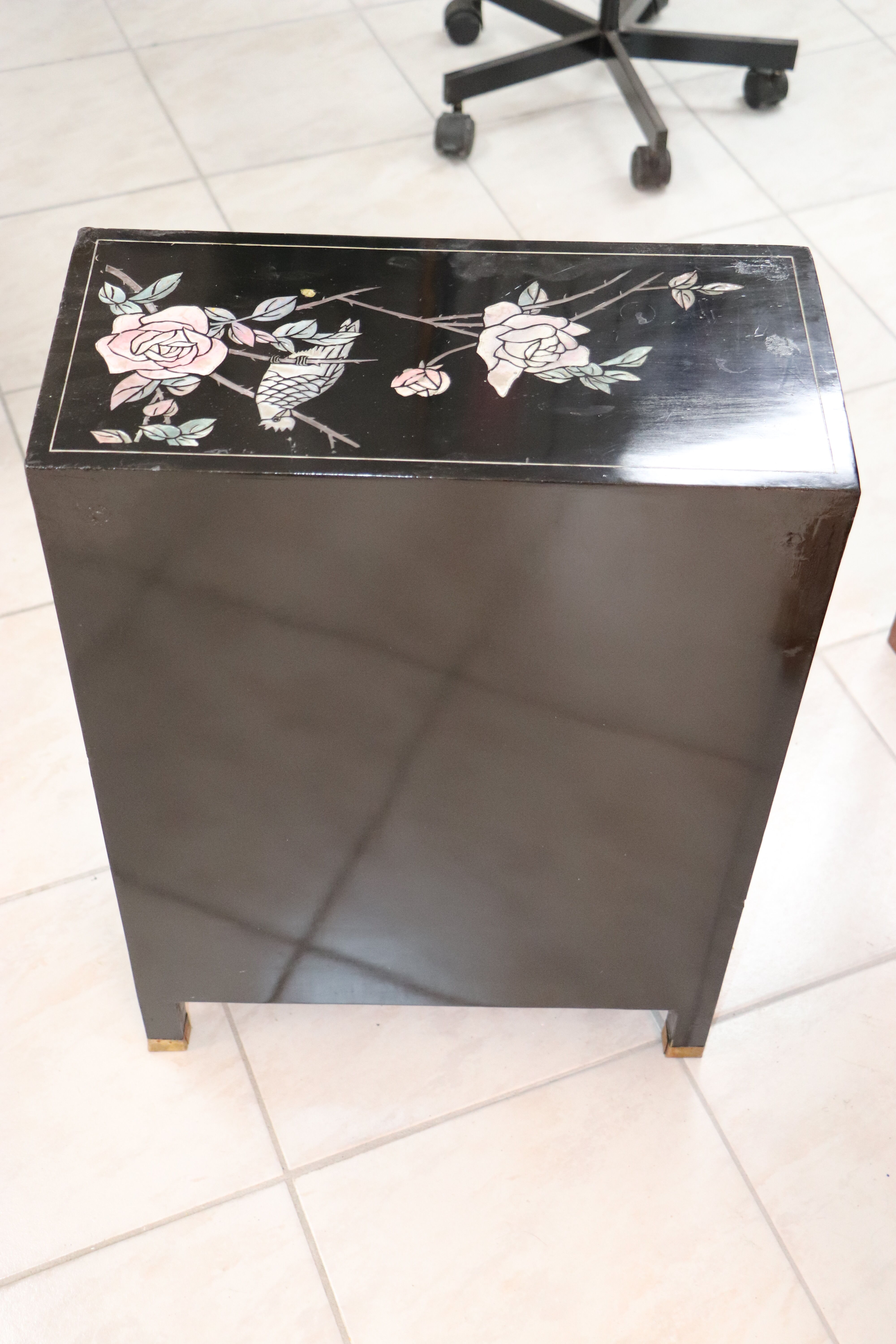 Small storage or bedside table lacquered black, incised and painted