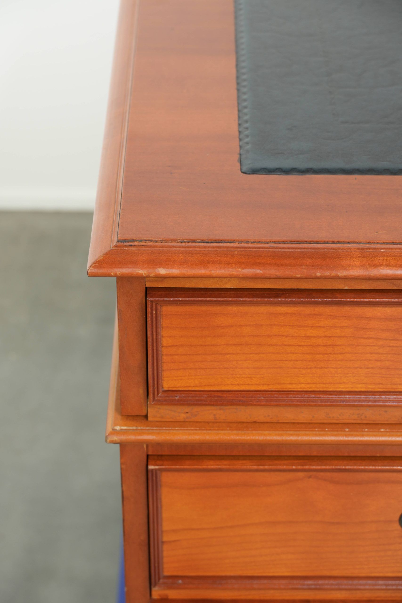 Classic wooden desk in English style with 4 drawers and a blue leather top