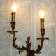 Bronze wall sconces decorated with acanthus leaves.