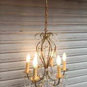 Remarkable cage chandelier with 6 lights and complete crystal pendants in working condition.