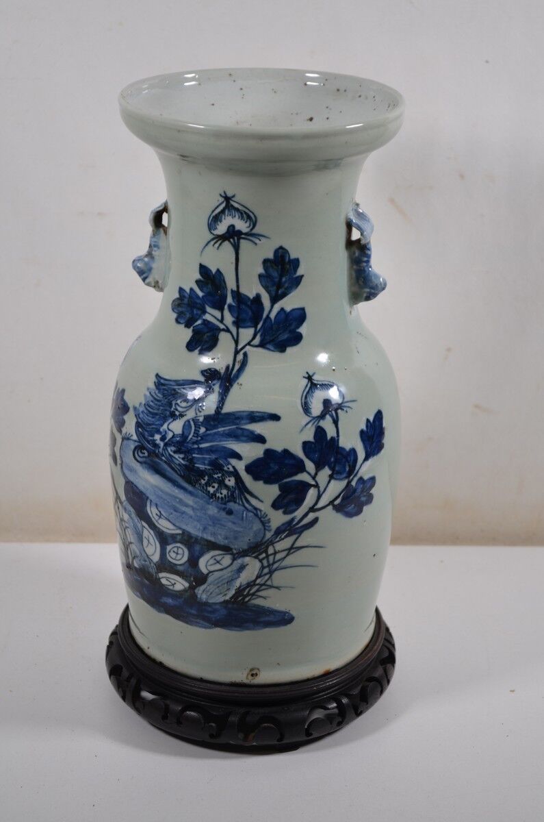 China. Porcelain mallet vase with blue and white phoenix decoration on a rock.