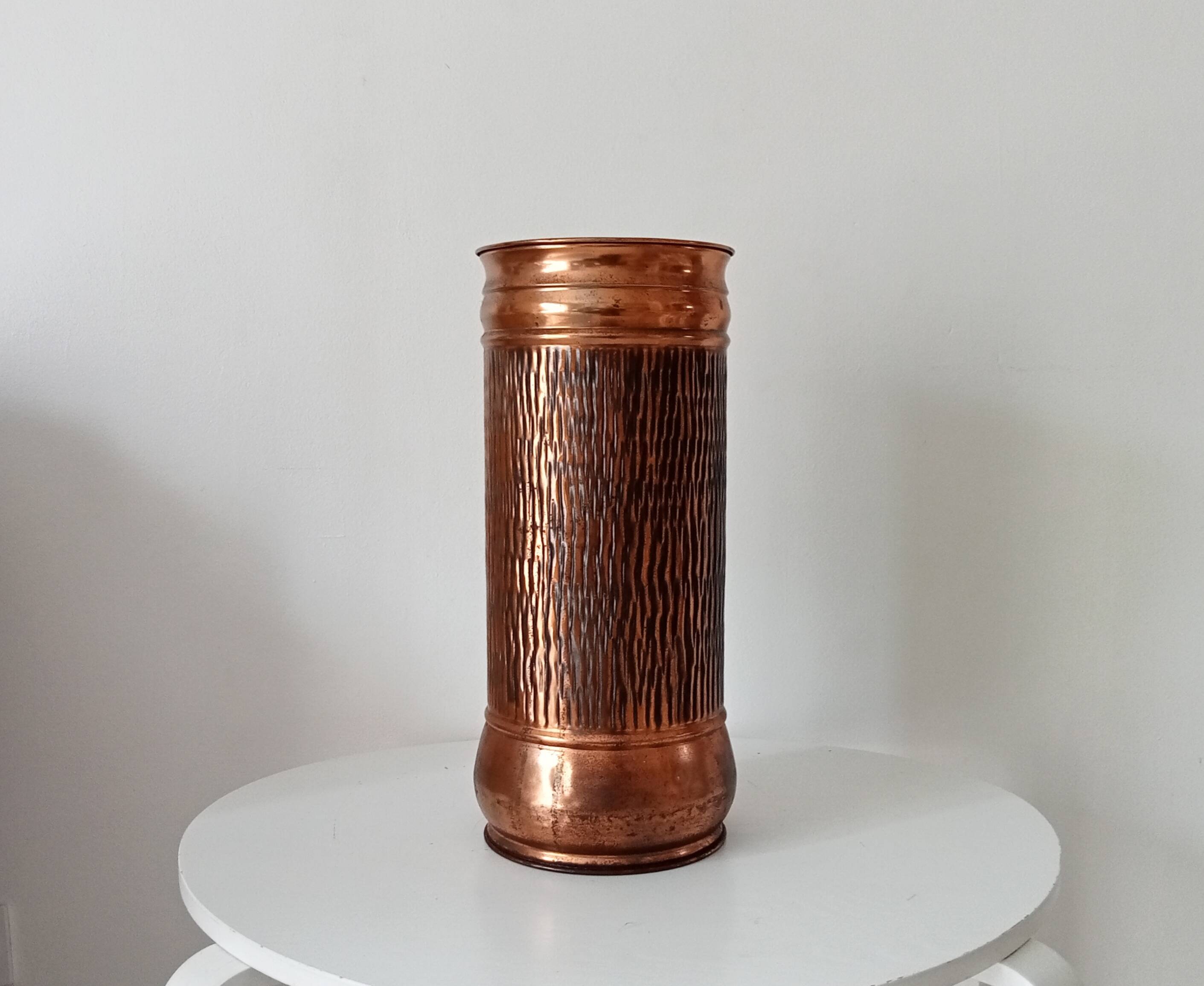 Vintage brutalist umbrella stand in hammered copper with a wood effect.