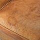 Vintage sheepskin club armchair finished with decorative nails