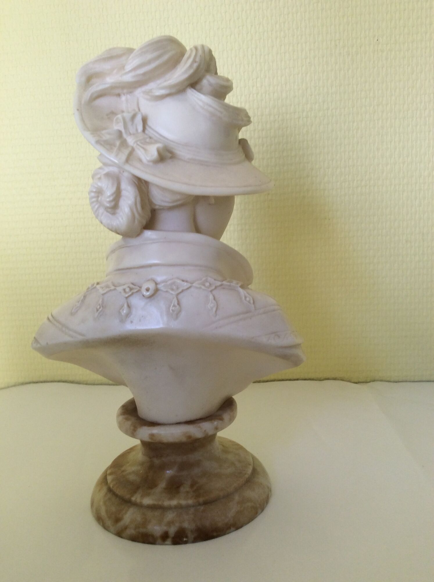 Bust of a young woman in the hat of A. Giannelli