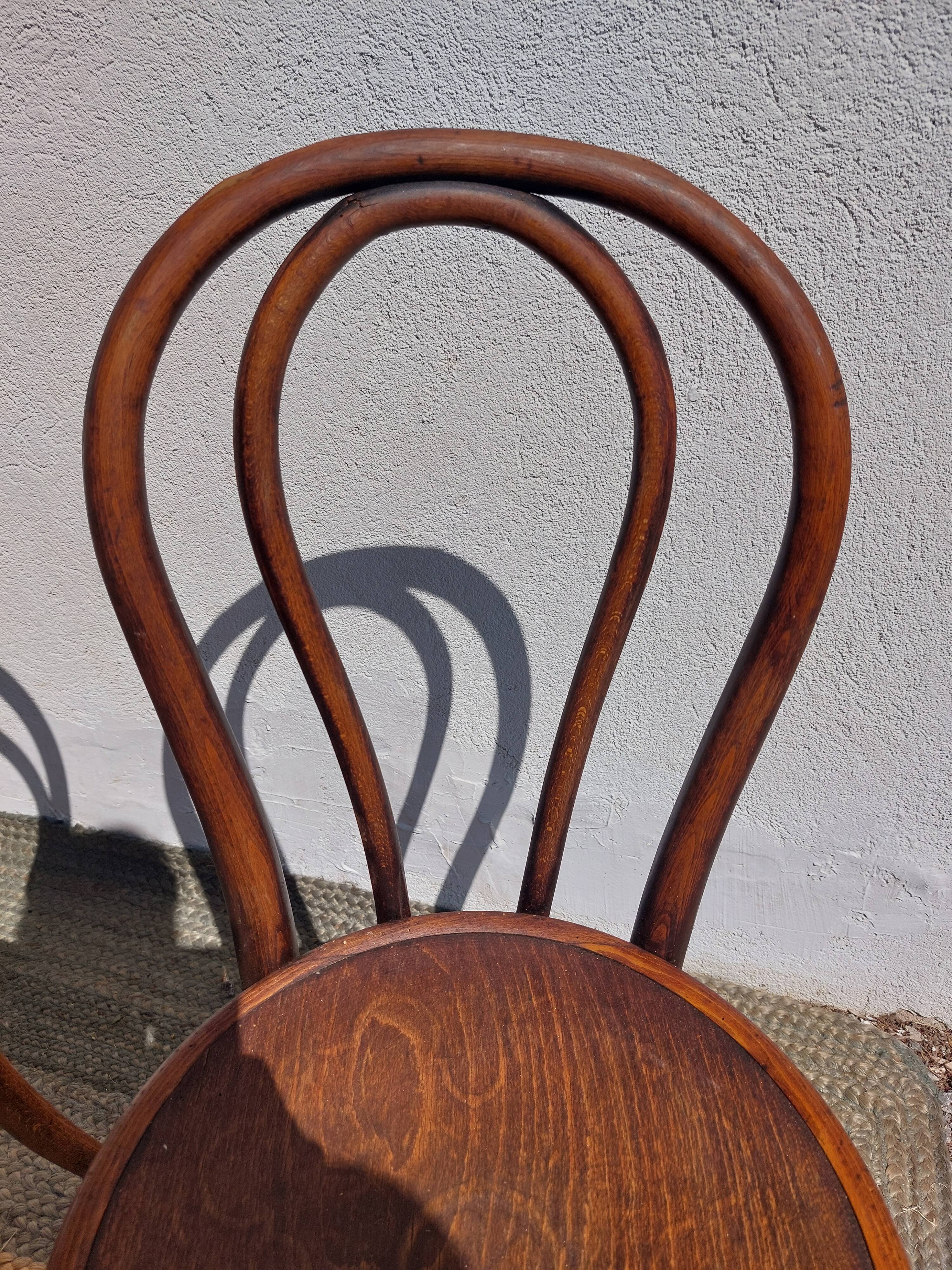 4 curved wooden bistro chairs