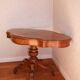 Large walnut guéridon with a sculpted base.
