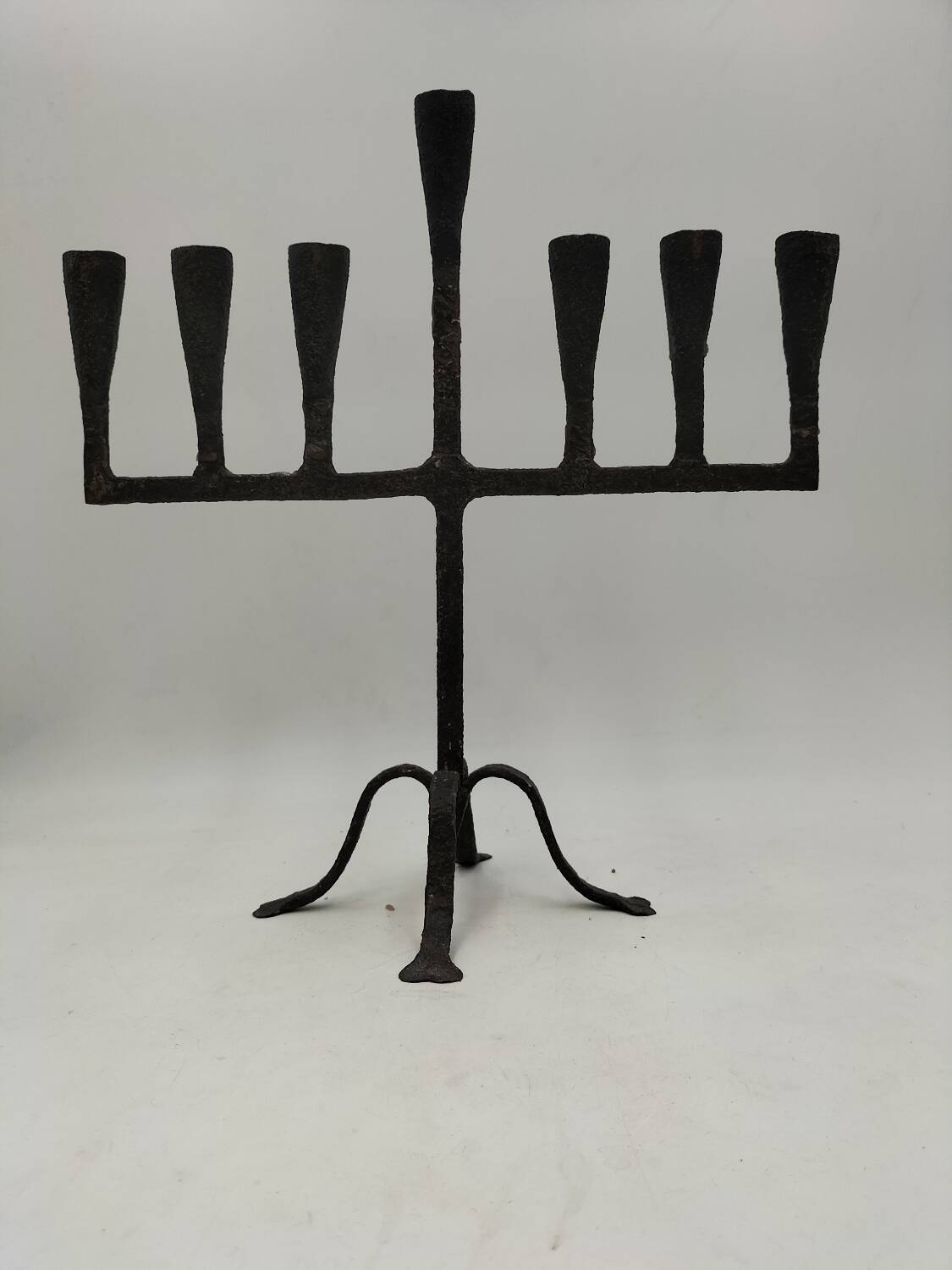 Brutalized wrought iron candle holder