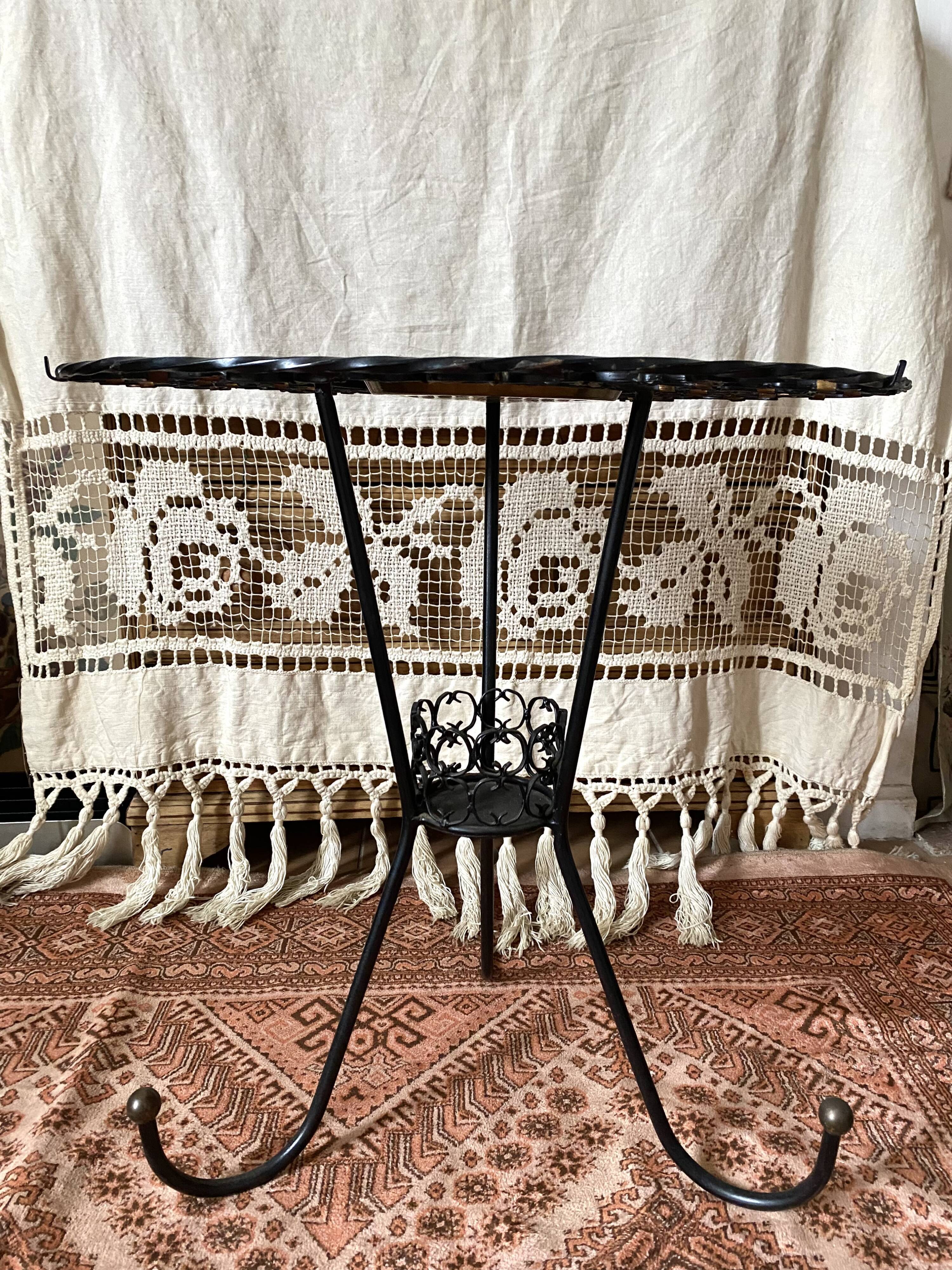 Wrought iron plant holder table from the 1950s