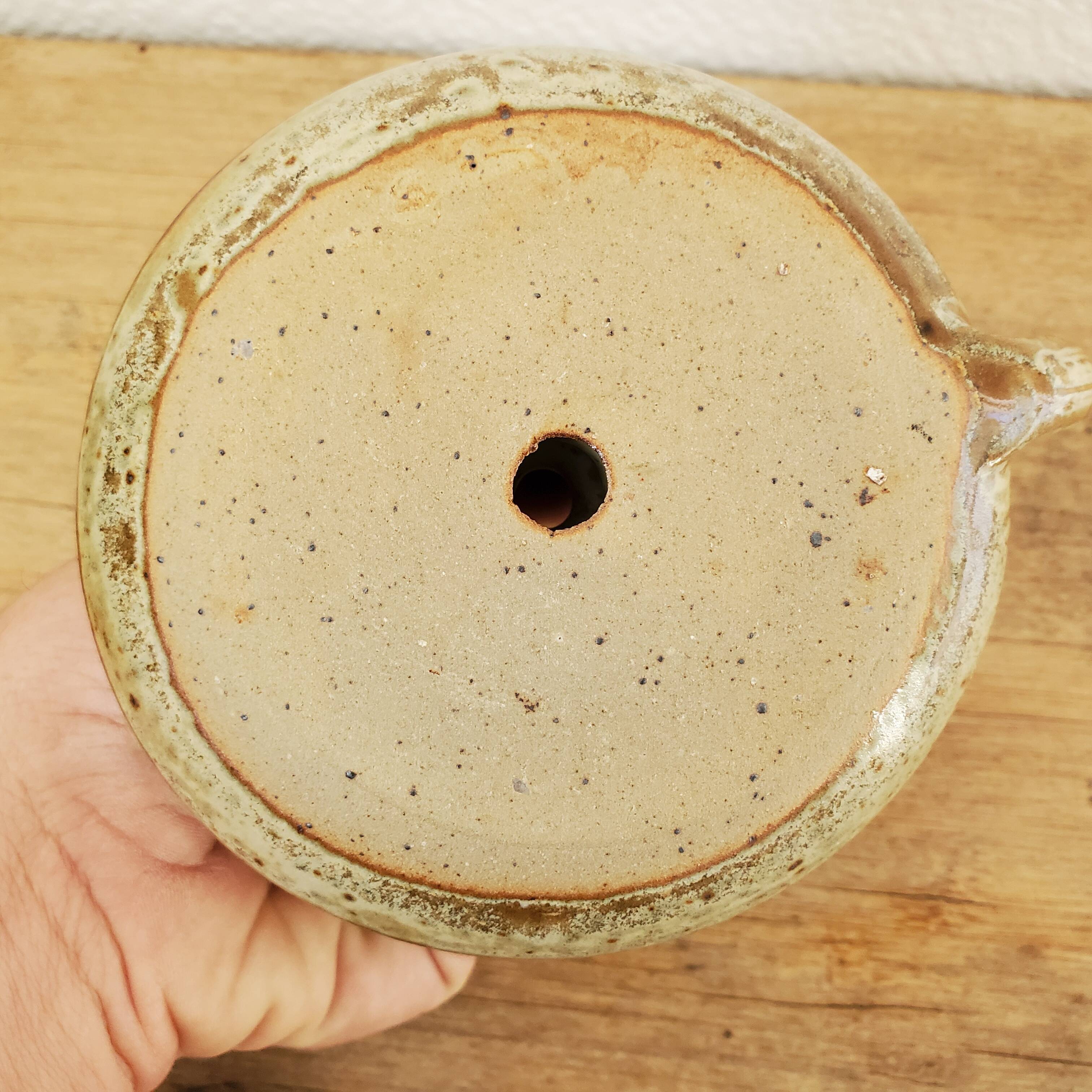 Sandstone candle holder called cellar rat