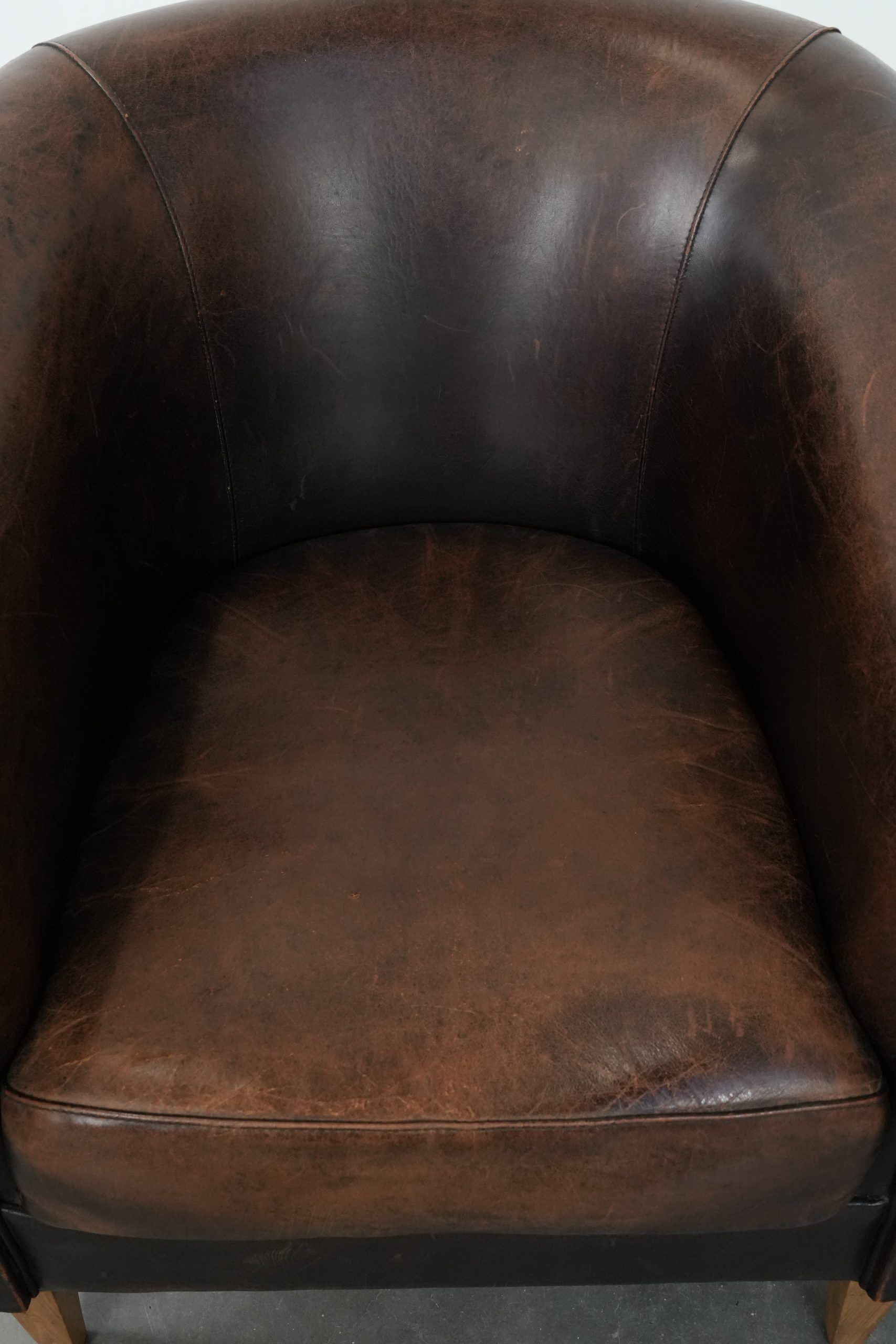 Characterful club armchair made of sheepskin with a beautiful patina