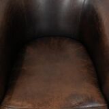 Characterful club armchair made of sheepskin with a beautiful patina