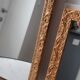 Paire de miroirs anciens en bois et en plâtre doré