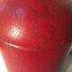Asian red metal pot with lid