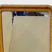 Louis Philippe mirror in wood and patinated stucco, 19th century.