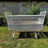 Vintage wicker bed with casters from the 50s in perfect condition