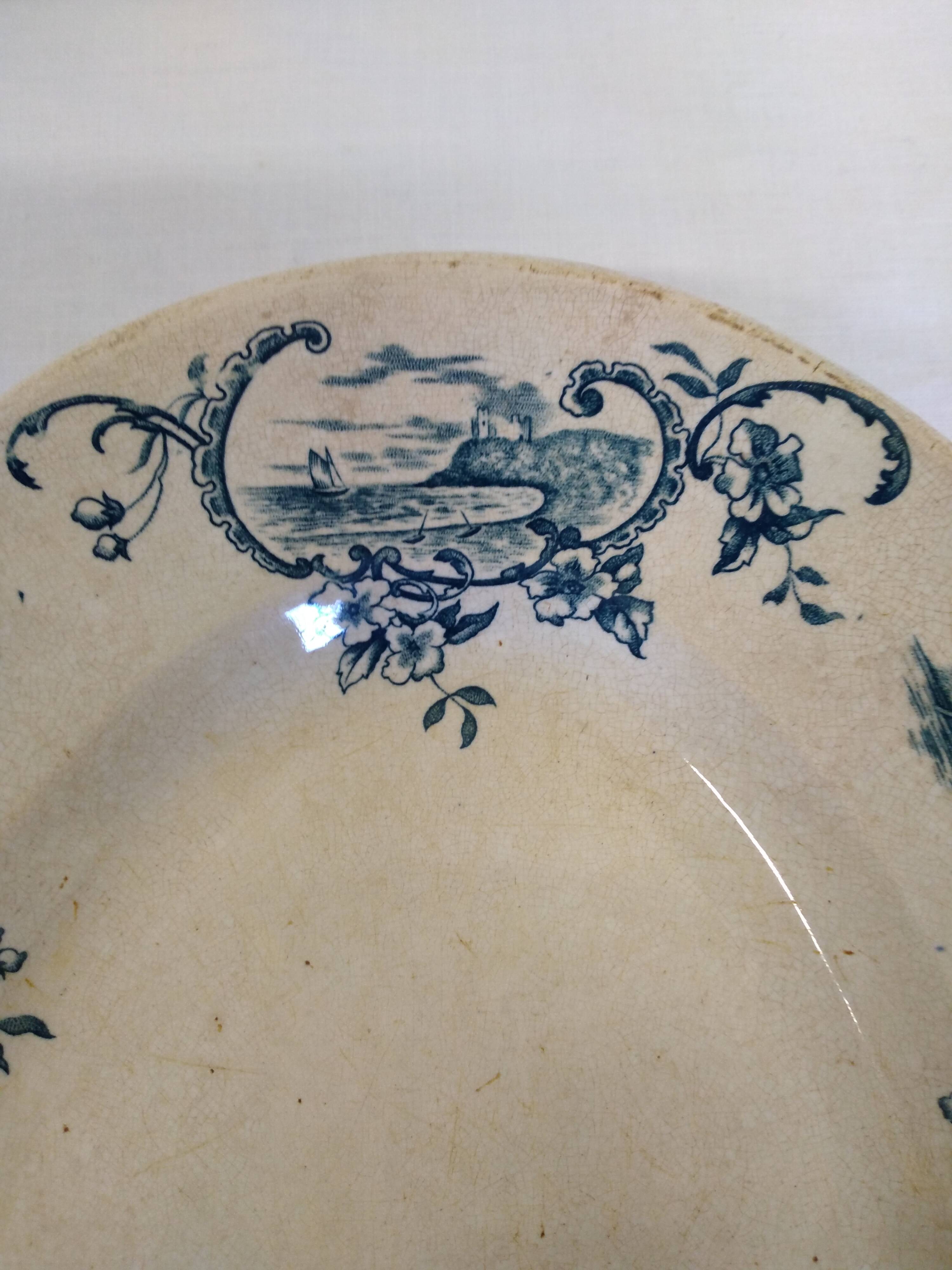 Old serving dish floral and maritime decoration