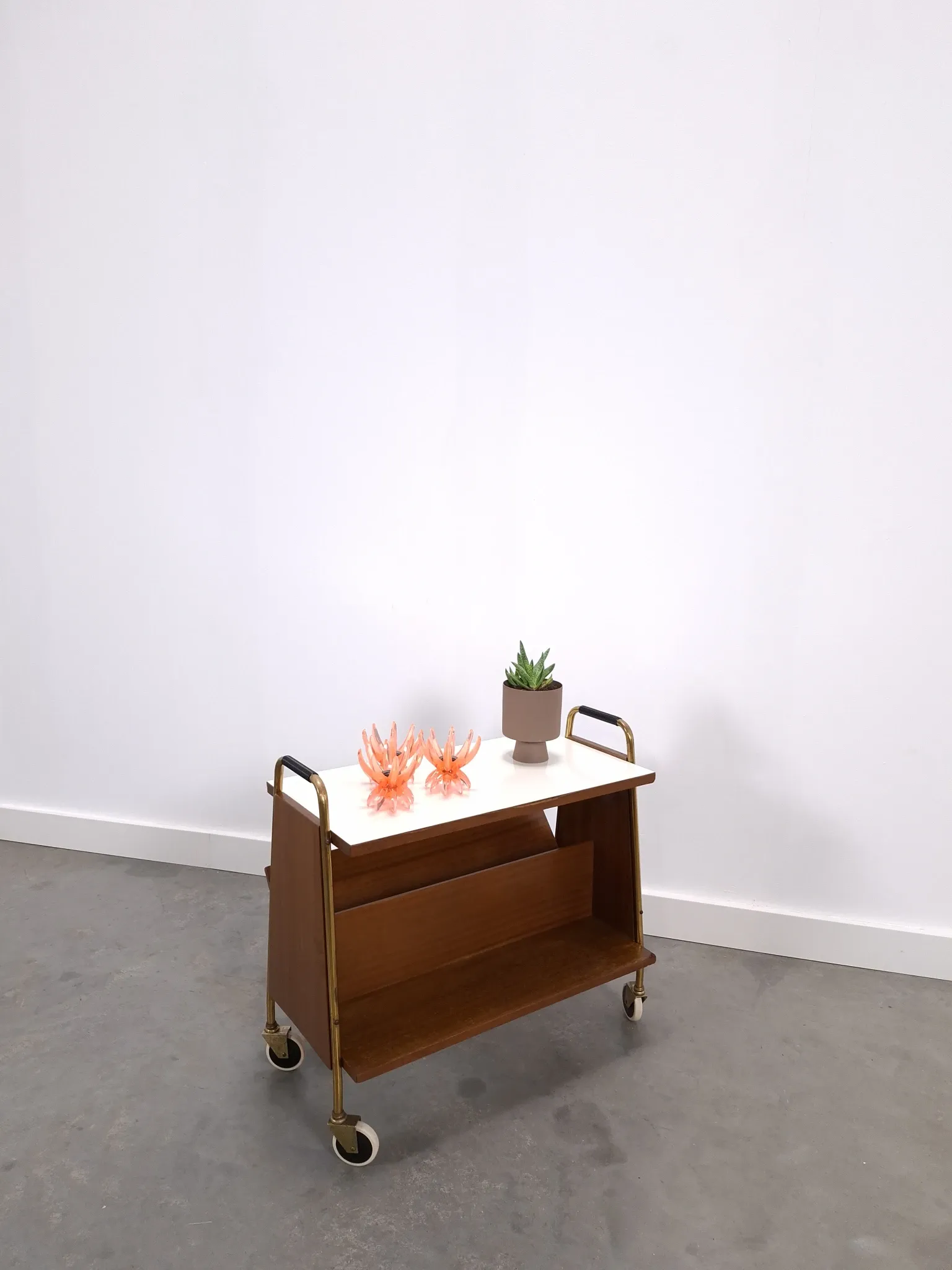 Vintage 1950s side table with a reading basket, formica top, teak wood.