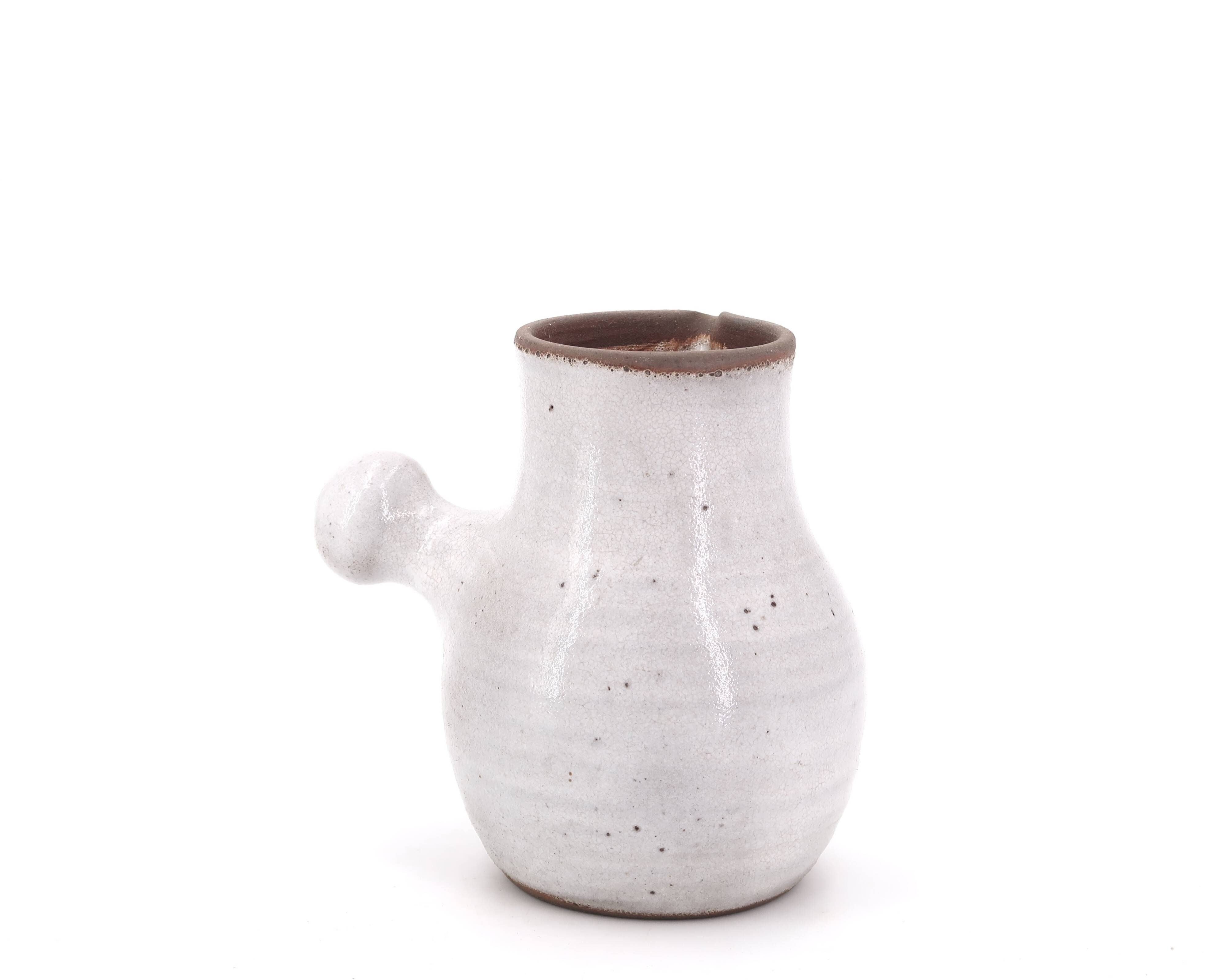 Minimalist white ceramic pitcher signed Pierlot, 1960s