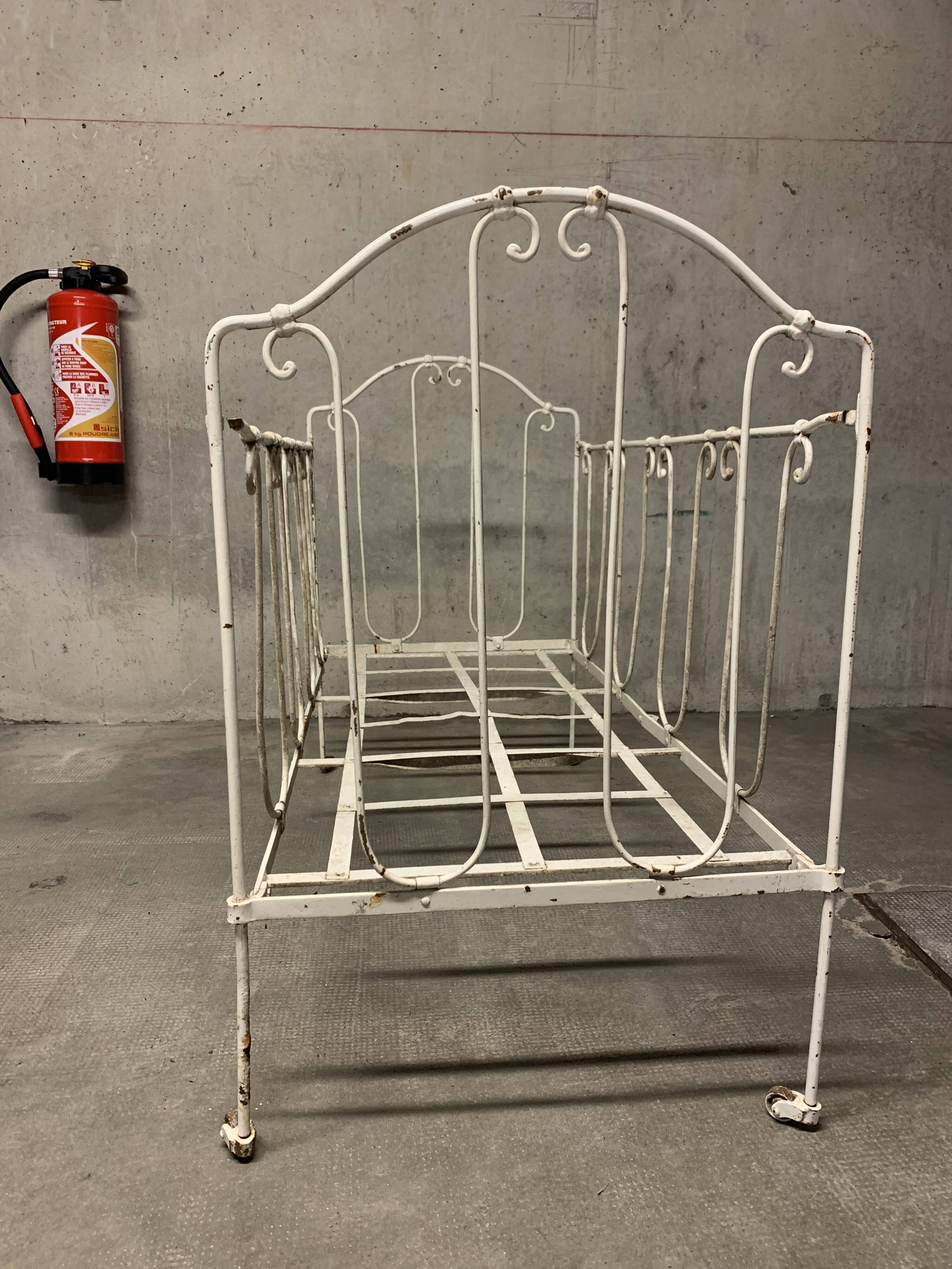 Old vintage wrought iron bench bed