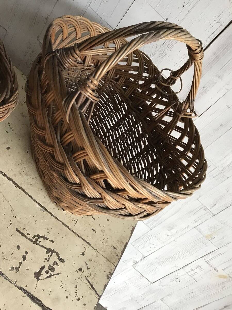 Set of 2 brown wicker baskets from the 1960s — decorative weaving and double handles.