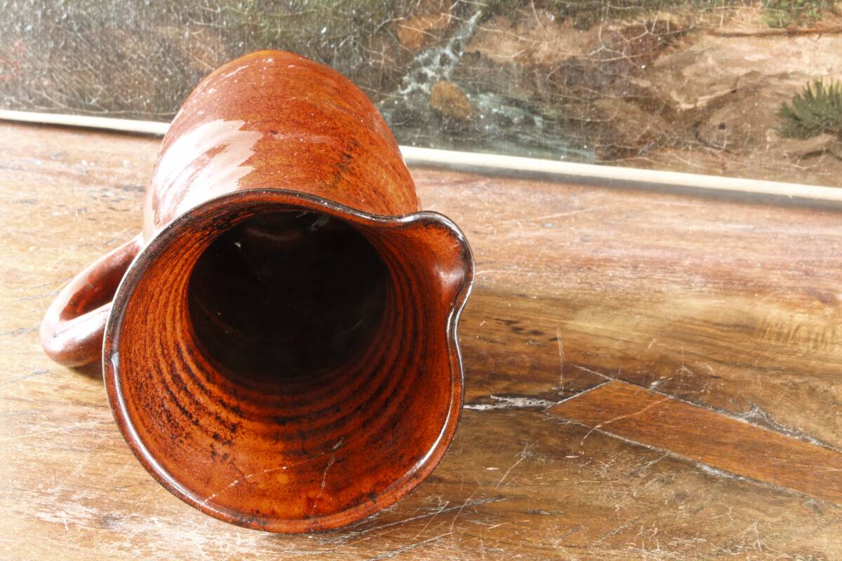 Signed orange ceramic candle holder and jug