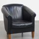 Black cowhide club chair in English style with a great luxurious design