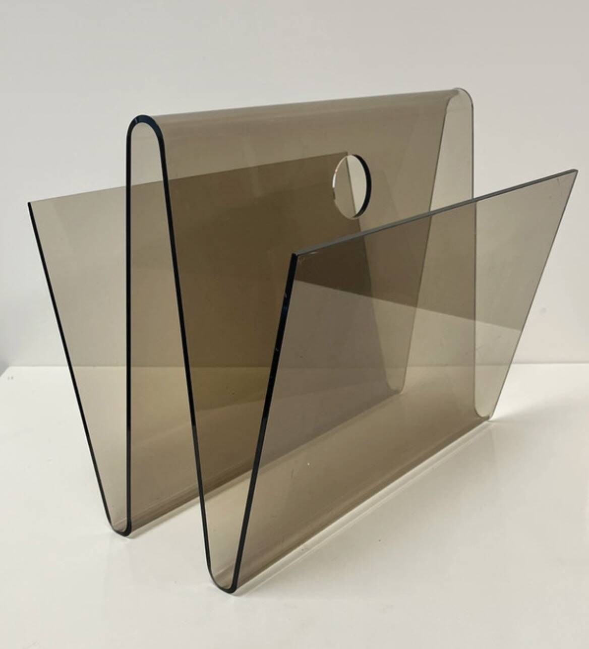 Smoked plexiglass magazine rack in the style of Michel Dumas, France, 1970s.