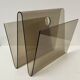 Smoked plexiglass magazine rack in the style of Michel Dumas, France, 1970s.
