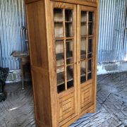 Vintage oak bookcase from the reconstruction period with 2 doors with small panes.