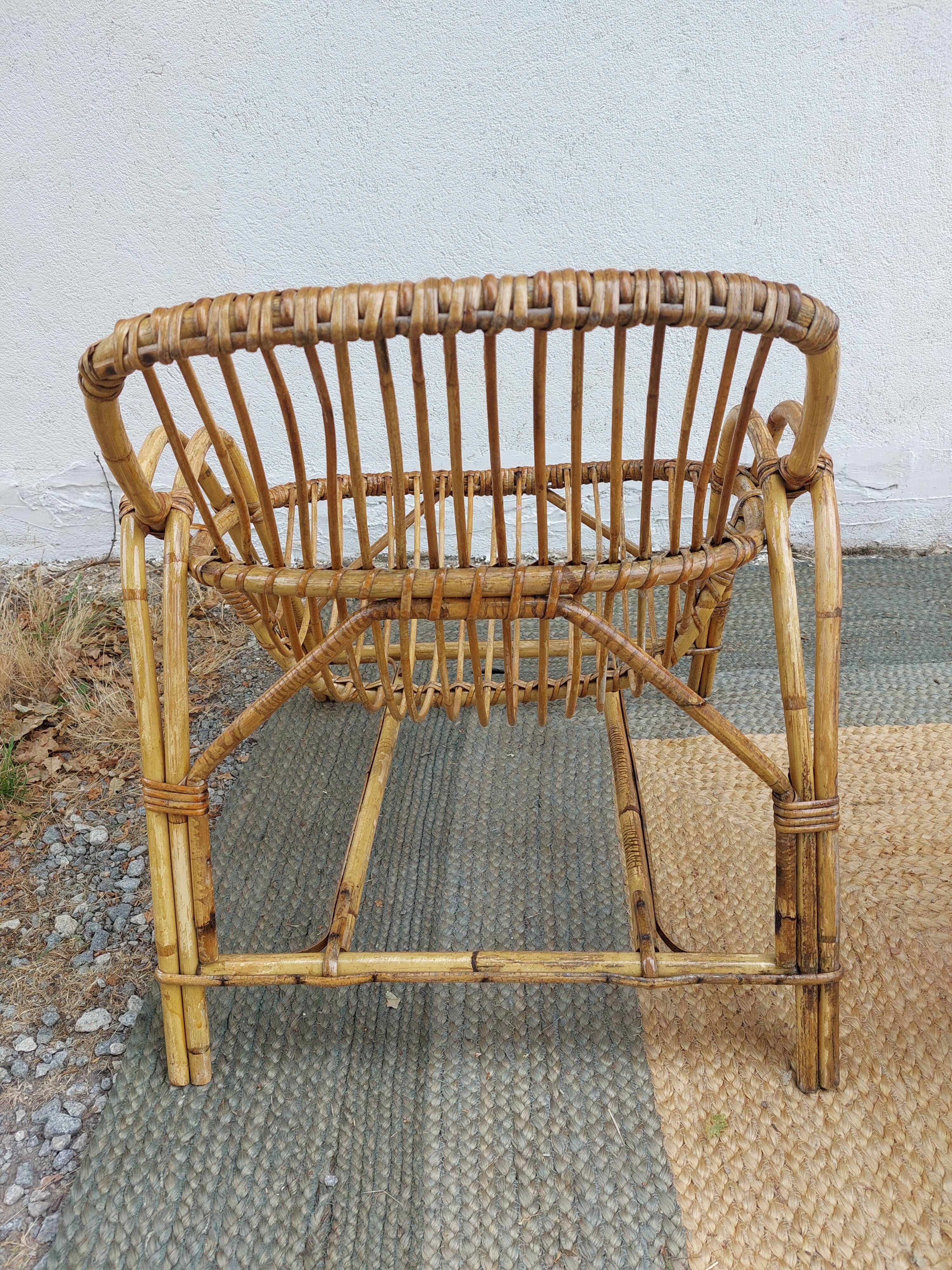 4 armchairs and a coffee table made of rattan and bamboo wood, vintage.