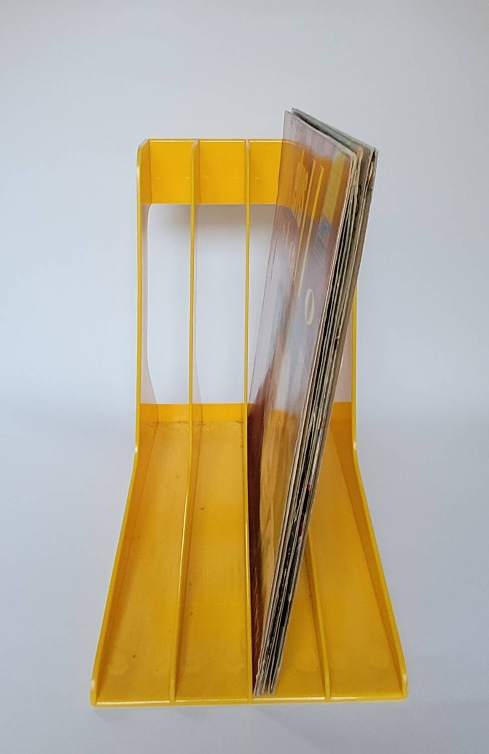 Yellow plastic vinyl racks from the 70s
