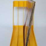 Yellow plastic vinyl racks from the 70s