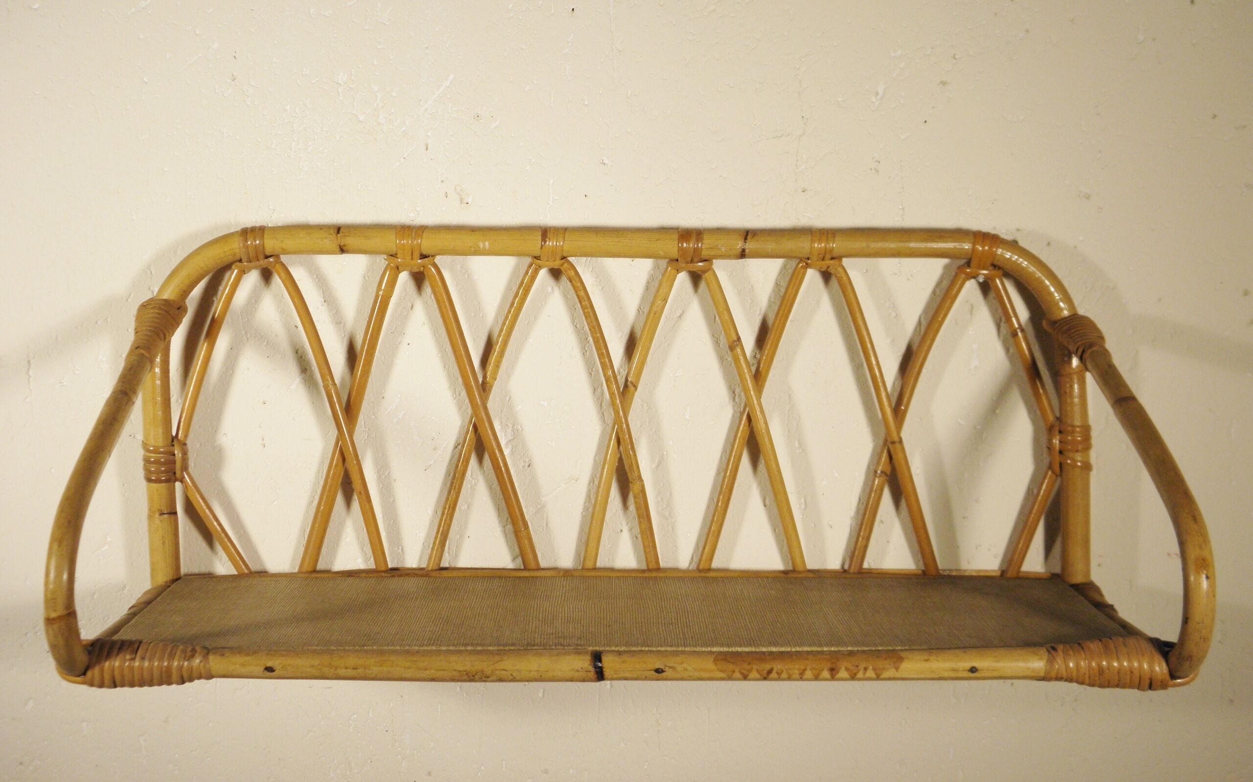 Rattan wall shelf