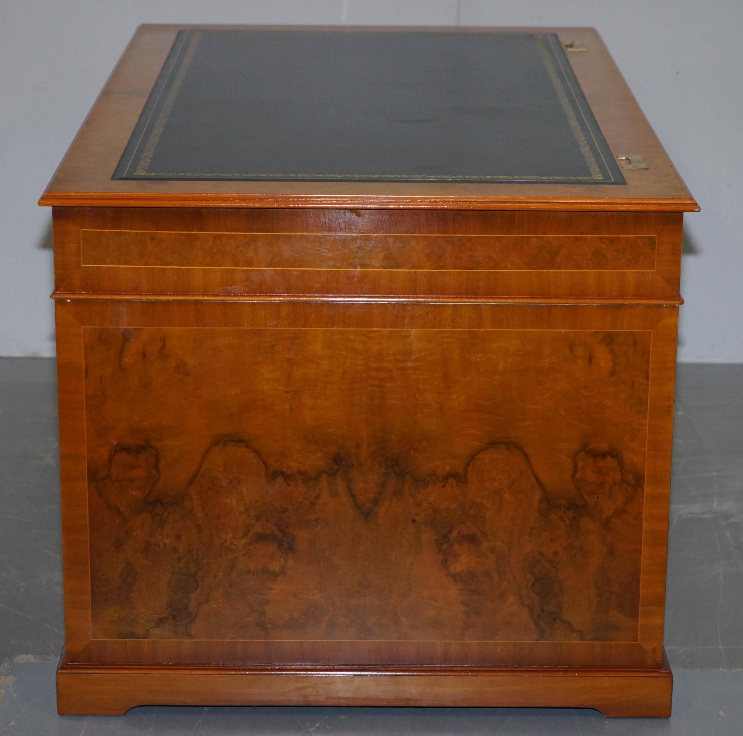 Partner desk in burr walnut designed to conceal computer equipment.