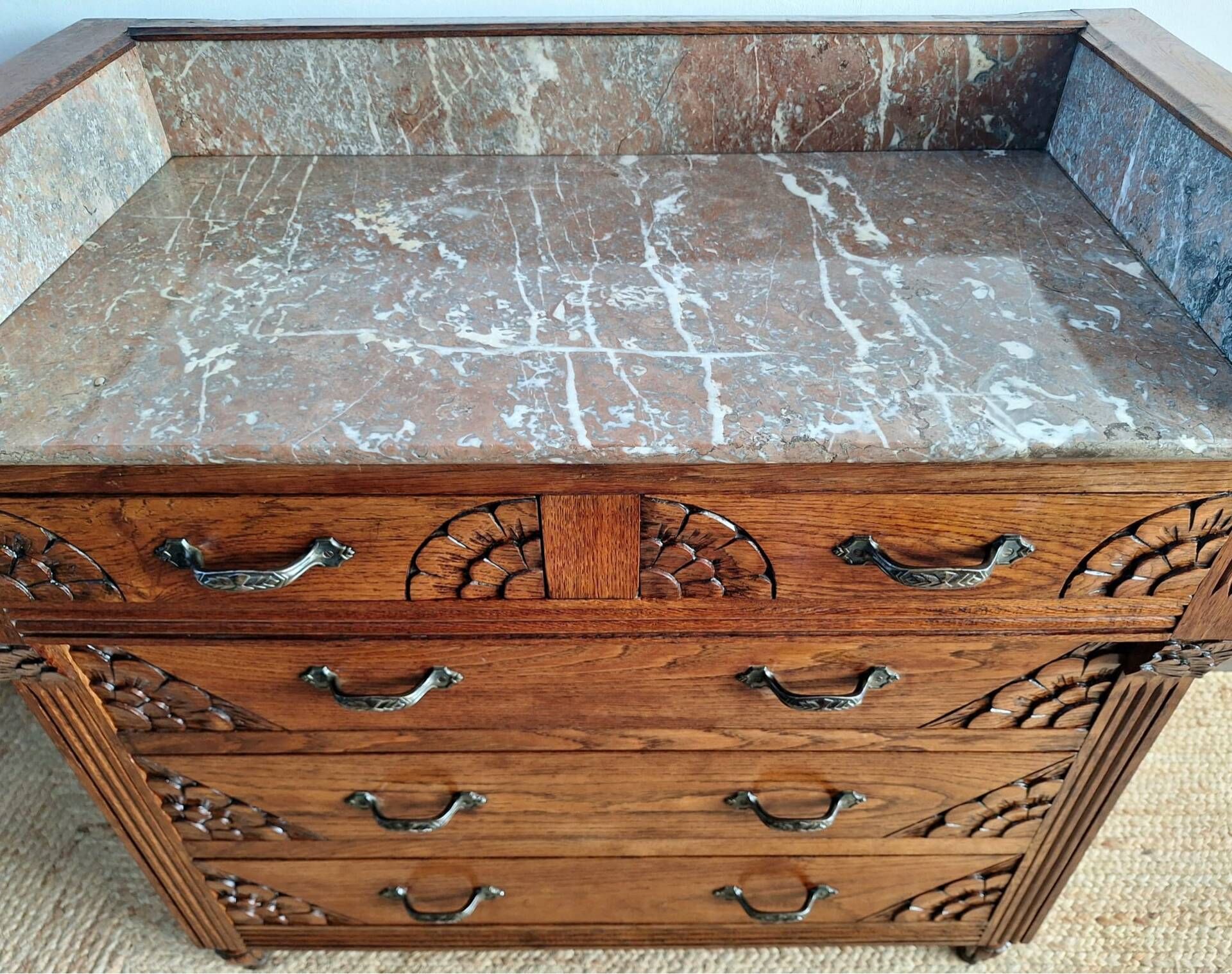 Art Deco commode with marble top, vintage antique furniture.