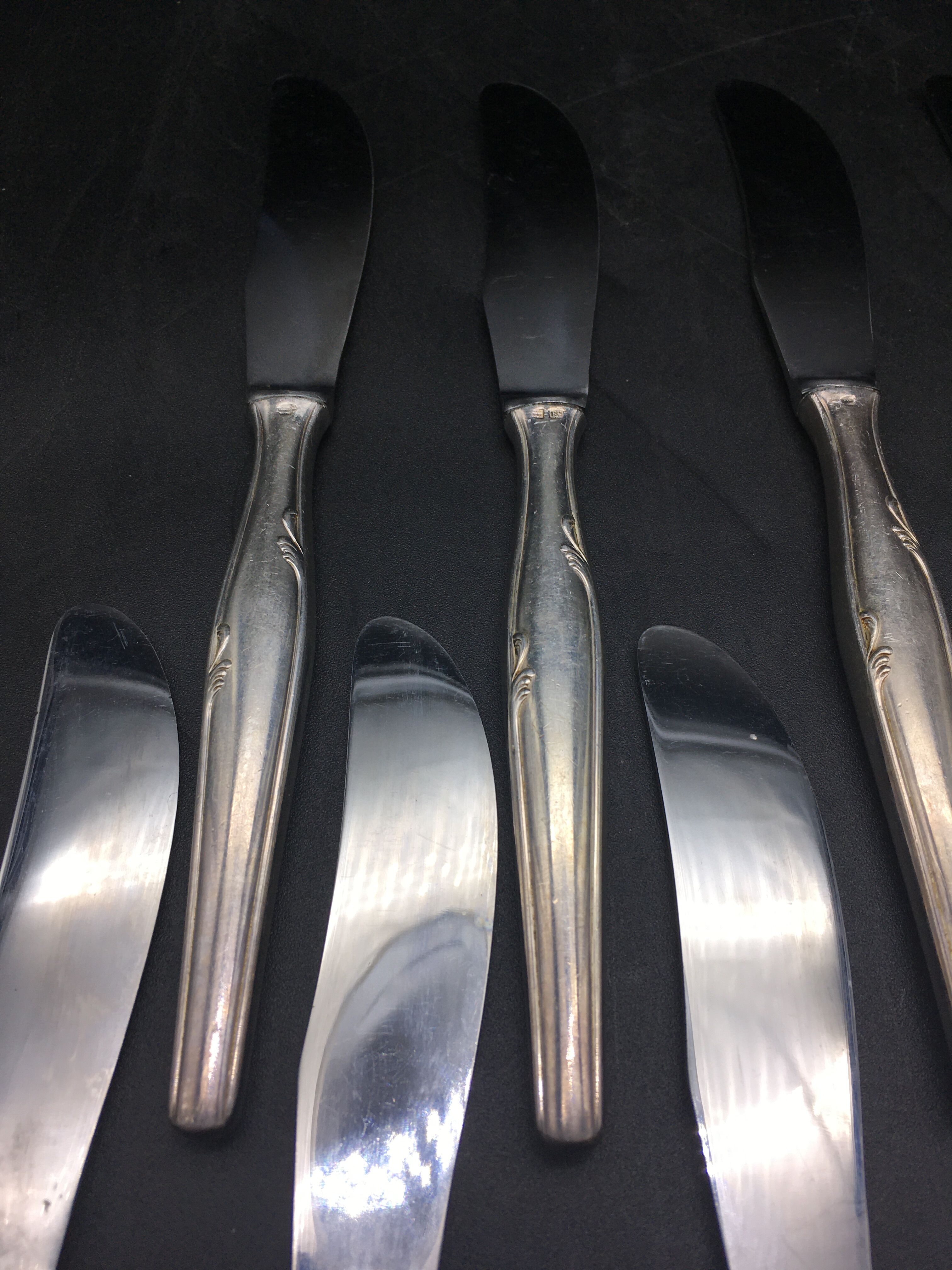 12 silver metal knives