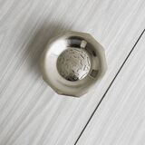 Antique butter dish in shiny metal