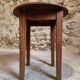 Antique round side table with oak legs and a pine top, circa 1900.