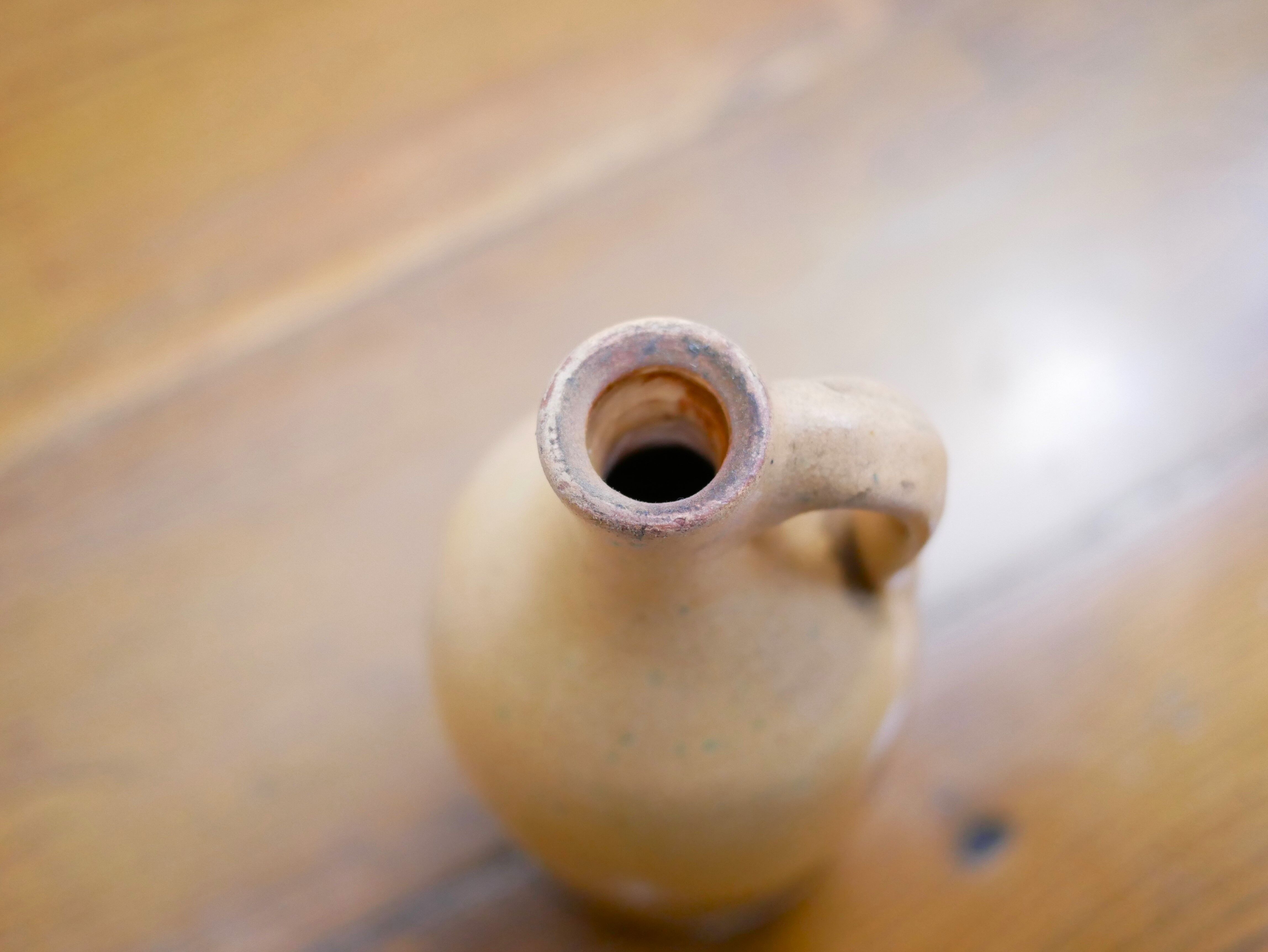 Vintage glazed terracotta bottle