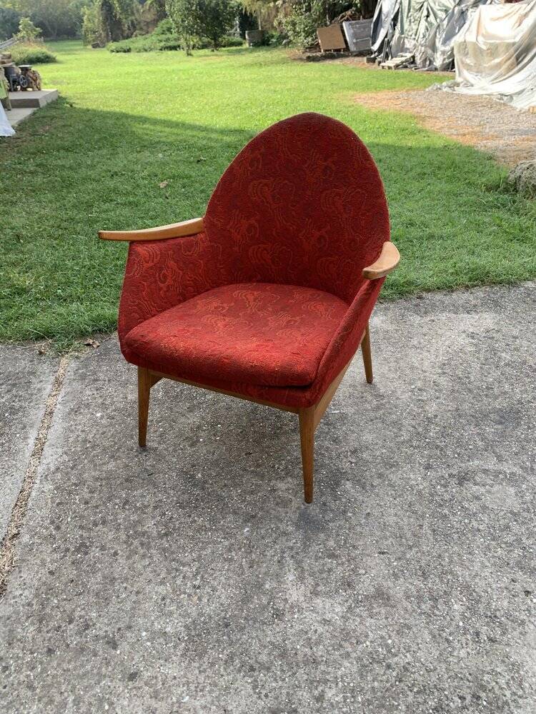 Red fabric armchair in Mid-Century Scandinavian style, high back and light wood legs (1960s)