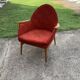 Red fabric armchair in Mid-Century Scandinavian style, high back and light wood legs (1960s)