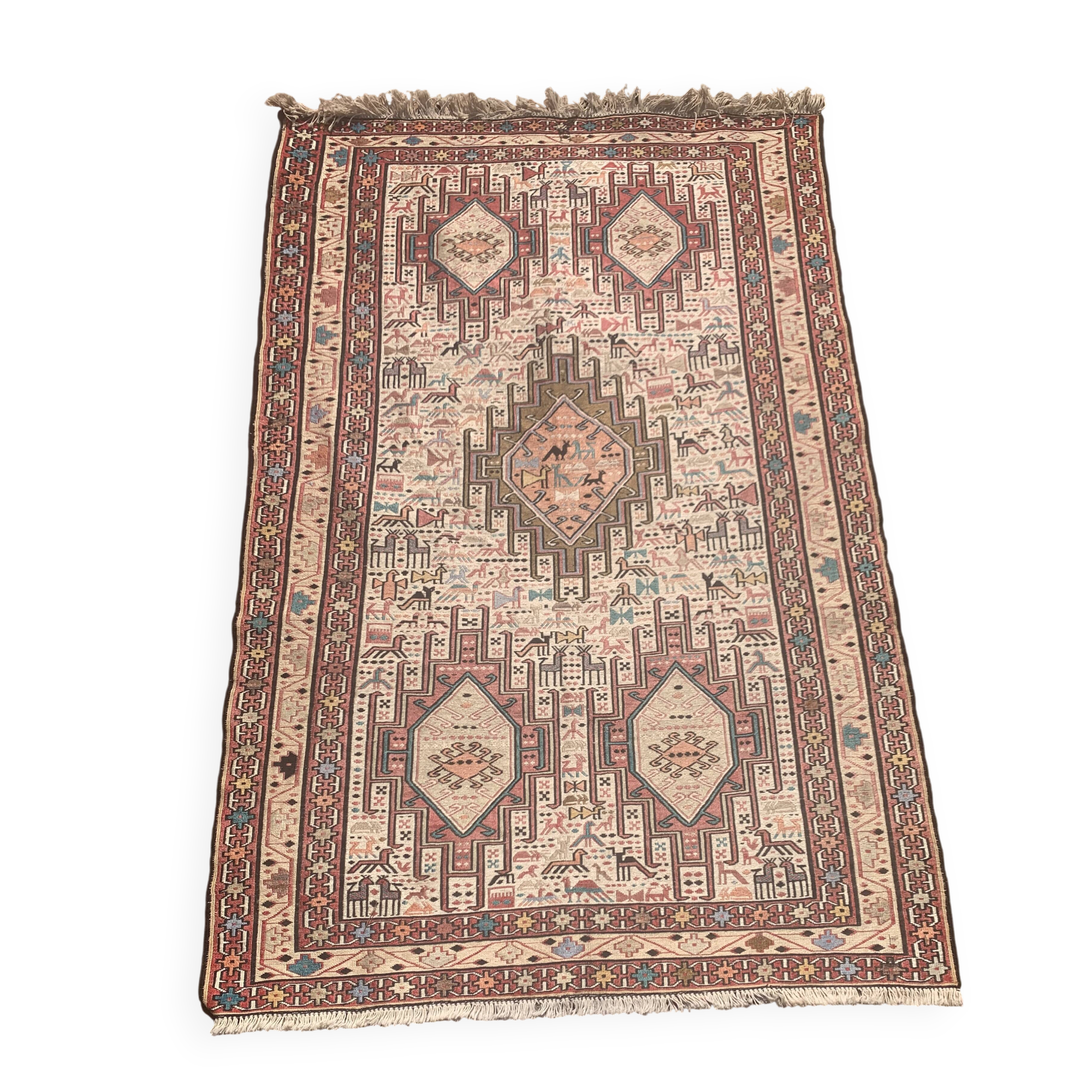 Hand-knotted silk carpet purchased in Iran – geometric and animal design –