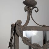 Wrought iron lantern with glass panels, leaf motifs